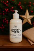 Load image into Gallery viewer, Bottle of goat milk tallow body lotion with a label on a wooden surface with a Christmas-themed background.